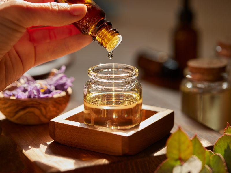 Preparing massage oil with essential oils at Lotus Dream Spa