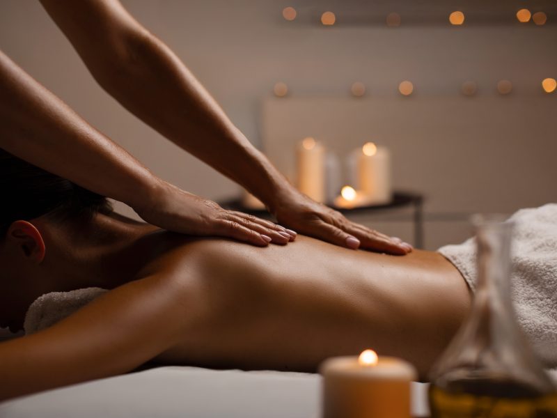 Lady receiving a relaxing back massage at Lotus Dream Spa